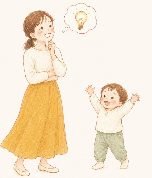 疑問が解けて明るい表情のお母さんと、両手を上げて喜ぶ子ども